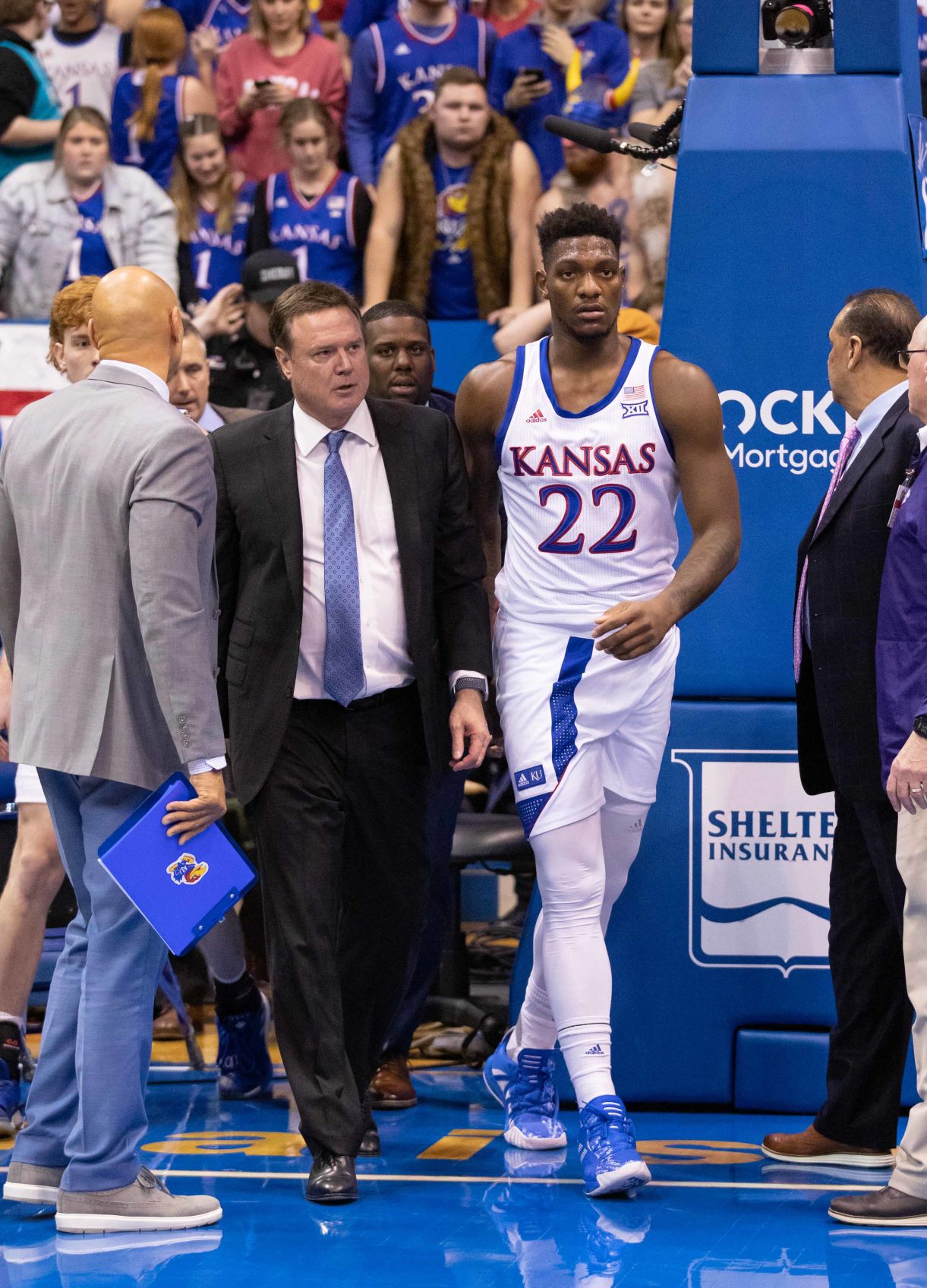 Coach Bill Self escorts junior forward Silvio De Sousa following an altercation against K-State.